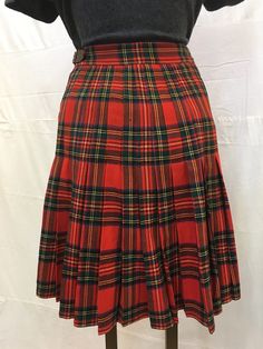 "1950s, 26\" waist, red and black traditional wool Scots plaid kilt. Wool is of summer weight, fasteners at waist with leather strip and brass bucket, and kilt pin in front. Pleats are gathered at back of kilt, front is flat. Measurements: waist 26\" Waist to hem 22\" Hips 36\" Width at bottom 60\" Condition excellent" Scottish Red Skirt For Fall, Red Scottish Style Fitted Bottoms, Red Tartan Fitted Bottoms, Kilt Pin, Printed Robe, Eyelet Dress, Antique Clothing, Silk Crepe, Kilt