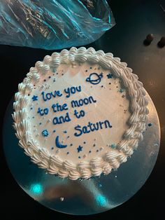 a birthday cake with the words i love you to the moon and back written on it