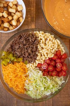 two bowls filled with different types of food next to each other on a wooden table