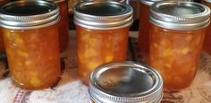 several jars filled with food sitting on top of a table