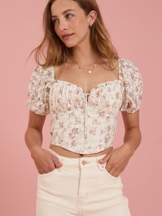 This top features puff sleeves with a lace fabrication. The corset-inspired bodice cinches your waist for a flattering silhouette, ensuring you turn heads wherever you go. Floral Corset Top, Corset Tops, Floral Corset, Lace Up Top, Chenille Sweater, Summer Clothing, Altar'd State, Girly Fashion, Romper With Skirt