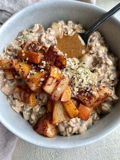 a bowl filled with oatmeal and potatoes