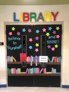 a library door decorated with books and signs