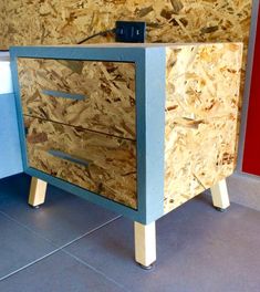 a cabinet made out of plywood is on the floor