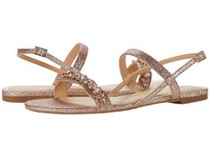 a women's sandal with two straps and jewel embellishments on the toes