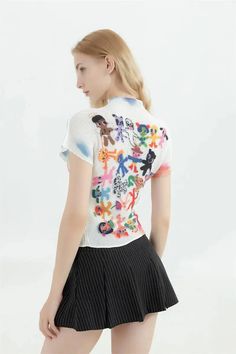 Inject a playful twist into your wardrobe with this adorable cartoon-printed top. Its vibrant design, adorning both front and back, is a nod to quirky, animated fashion. Pair it with high-waisted jeans or a flared skirt for a fun, youthful ensemble that's sure to turn heads. A must-have for those who embrace a playful, teen-inspired aesthetic with a dash of cuteness. Short sleeve Crew neckline Cartoon figures printed at front and back Polyester Korean Y2k, Aesthetic Clothing Stores, 2000s Clothes, Hand Painted Clothing, Top Clothes, Collars For Women, Vintage Streetwear, Fashion Vintage, Mode Vintage