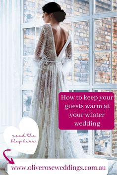 a woman standing in front of a window wearing a wedding dress with the words how to keep your guests warm at your winter wedding