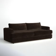 a brown couch sitting on top of a white floor