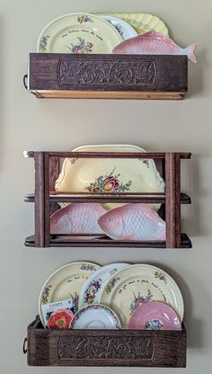 three wooden shelves holding plates and bowls