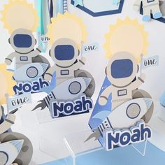 some paper cut outs that say noah and one is in the shape of a rocket ship