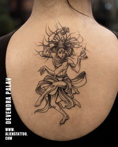 a woman with a tattoo on her back