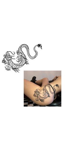 a woman with tattoos on her legs and arm sitting next to a drawing of a dragon