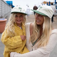 A two-tone corduroy hat with an embroidered palm tree and the perfect palm green to match. This hat has an adjustable velcro back and been worn on toddlers, big kids, moms, and dads -- it literally looks good on everyone. Size 1: Designed to fit kids aged 9 months to 2 years Size 2: Designed to fit kids aged 3 to 5 years Size 3: Designed to fit kids aged 6 to 10 years Adult: One size fits most Not sure on sizing? Check out our guide. Tips for cleaning your hat can be found here. Casual 5-panel Dad Hat For Beach, Fun 5-panel Baseball Cap For The Beach, Fun 5-panel Baseball Cap For Beach, Green Cotton Baseball Cap For Beach, Beach Green Cotton Baseball Cap, Green Flat Brim Baseball Cap For The Beach, Green Flat Brim Baseball Cap For Beach, Casual Green Trucker Hat For Vacation, Adjustable 5-panel Dad Hat For Beach