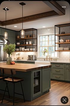 a kitchen with green cabinets and wood floors is shown in this image, there are two stools at the center of the island