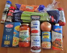 an assortment of food items sitting on top of a wooden table