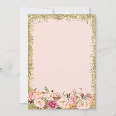 a pink and gold floral card with glitter border on the bottom, in front of a marble background