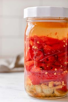 a jar filled with food sitting on top of a counter