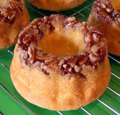 several bundt cakes sitting on a cooling rack