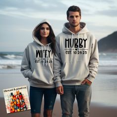 "Wedding Hoodie, Matching Couple, Honeymoon Couple, Wifey Sweatshirt, Hubby Sweatshirt, Wifey Hubby Hoodie, Wife Husband Sweatshirt Your choice of hoodie or sweatshirt with your choice of Wifey or Hubby along with your wedding date in white or black vinyl. **SOLD SEPERATELY** Celebrate your love and style with our Personalized \"Wifey\" or \"Husband\" Hoodie/Sweatshirt. This customizable sweater allows you to add a personal touch to your attire by featuring your chosen title along with your special wedding date. It's the perfect way to showcase your commitment and unity in comfort and fashion. Design Features: Your Choice of Title: Select either \"Wifey\" or \"Husband\" to proudly display your relationship status. Personalized Wedding Date: Your wedding date is elegantly incorporated into Husband And Wife Sweatsuit, Husband And Wife Hoodies, Honeymoon Sweatshirt, Hubby And Wifey Sweatshirts, Wedding Hoodie, Fiance Sweatshirt, Wifey Sweatshirt, Personalized Sweater, Matching Sweaters