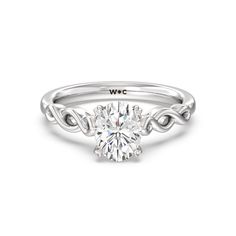 a white gold engagement ring with an oval cut diamond in the center and twisted band