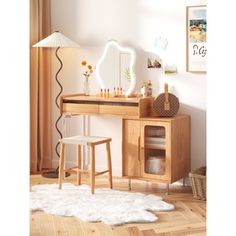 a wooden desk with a mirror and stool