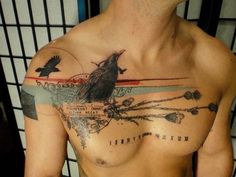 a man with a bird tattoo on his chest