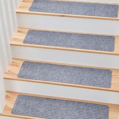 carpeted stair treads on the bottom of stairs