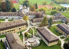 an aerial view of several buildings and gardens