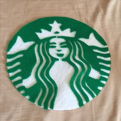 the starbucks logo is made out of felt