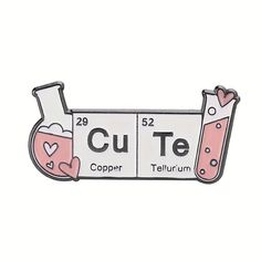 a pink and white enamel pin with the word cut te copper in it's center