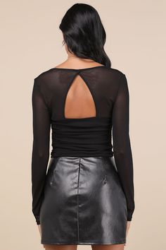 Your date will be in awe of you all night long when you're wearing the Lulus Coy Cutie Black Mesh Bustier Long Sleeve Crop Top! This sultry mesh top starts with a bustier-inspired bodice with padded cups and supportive underwire, a flirty sweetheart neckline (with hidden no-slip strips), and sheer long sleeves. The fitted silhouette features flattering ruching along the sides and an eye-catching cutout at the back, before finishing at a cropped hem. Fit: This garment fits true to size. Length: Size medium measures 18" from shoulder to hem. Bust: Great for any cup size. Waist: Fitted - stretchy fabric allows custom fit. Undergarments: Padded cups - May be worn with an adhesive bra, petals, or no bra. Fabric: Fabric is very stretchy. Bodice is lined. Shell: 95% Nylon, 5% Spandex. Lining: 100 Elegant Fitted Sheer Crop Top, Fitted Tops For Fall Club Outings, Fitted Tops For Club In Fall, Fitted Fall Tops For Club, Sheer Fitted Crop Top For Night Out, Flirty Fitted Blouse For Fall, Fitted Crop Top With Sheer Sleeves For Fall, Fitted Flirty Blouse For Fall, Fitted Tops With Sheer Bodice For Spring