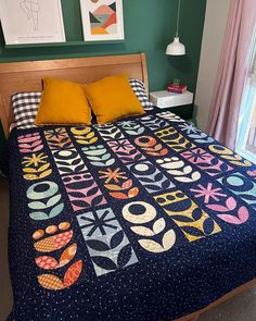 a bed with a quilt on top of it