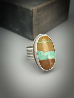 Gorgeous Nevada Royston turquoise gemstone ring. The band is handcrafted and the word *Courage* is on the inside. Size 8 Nevada Royston Turquoise ring 20 carats  The band is 9.98mm wide Sterling silver setting. My signature and .925 are on the piece. All my pieces are 100% handmade by me. Please note that this ring cannot be resized because of the stone. My rings are all handmade and hand sawed. I do not cast rings. All my turquoise and other gemstones are sourced from highly reputable dealers. All my pieces are genuine. Some stones may have inclusions. That is the nature of the gemstone.  Each box jewelry is packaged has a special painting on the top from me. Thanks for stopping by. Special Painting, Cast Rings, Hand Saw, Royston Turquoise, Box Jewelry, Ring Women, Wide Bands, Turquoise Gemstone, Ring Sterling Silver