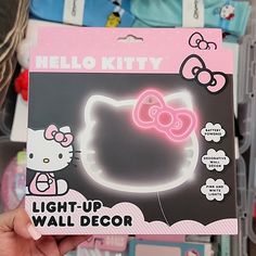 the hello kitty light up wall decor is displayed in a store display case with other items