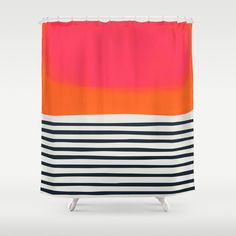 a shower curtain with an orange, pink and black stripe design on it's side