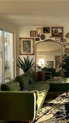 a living room filled with lots of green furniture