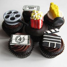 cupcakes with movie themed decorations on them