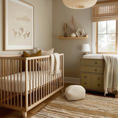 a baby's room with a crib and dresser