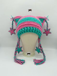 a crocheted hat on top of a mannequin head