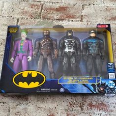 the batman action figures are in their original packaging, but they're not real