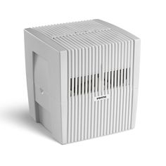 an air conditioner sitting on top of a white surface