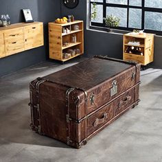 This Vintage Style Coffee Table combines the charm of yesteryears with modern functionality. Crafted with a sturdy wooden frame, it features a luxurious leather exterior that adds an elegant touch to any living room. The metal accents and retro lock enhance its nostalgic appeal, while the decorative patterns provide unique character. Measuring compactly, it fits seamlessly in various spaces, serving as both a functional coffee table and a striking decorative piece. | Industrial Style Sofa Vintag Sofa Industrial, Functional Coffee Table, Vintage Core, Archie Bunker, Sofa Vintage, Style Coffee Table, Cozy Dog Bed, Teen Bedroom Furniture, Door Hardware Interior