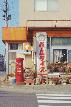 an old store front on the corner of a street