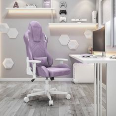 a purple office chair sitting in front of a computer desk with shelves on the wall