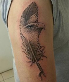 a woman's arm with a feather tattoo on it