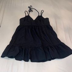 Never Worn Black Sundress For Summer Night Out, Chic Black Sundress For Spring, Black Sundress For Day Out, Black Ruffled Sundress For Spring, Black Mini Sundress With Ruffles, Black Mini-length Summer Dress, Black Mini Length Summer Dress, Casual Black Mini Dress For Vacation, Black Ruffled Mini Sundress