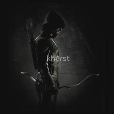 the arrow man is standing with his bow in hand