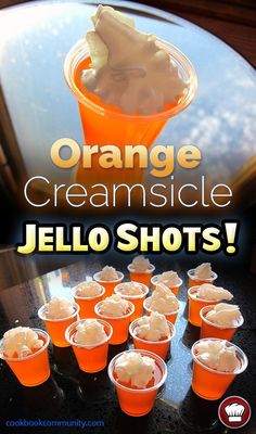 orange creamsice jello shots are arranged on a table with the words, orange creamsice jello shots