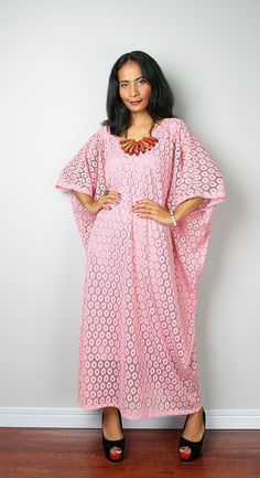 "A stunning bohemian lace caftan dress with a subtle v shaped neck and backbone The dress is handmade from a quality polyester lace fabric and has a gorgeous flow. The big wide sleeves and trendy design gives a romantic feel to this dress, which has very tidy sewing and is made with the highest care. The measurements given below are based upon the inner lining. This gorgeous boho soft dusty pink lace dress is ideal for a family gathering, going to the beach, a garden party, a nice evening out on Bohemian V-neck Maxi Dress With Lace Patchwork, V-neck Lace Patchwork Maxi Dress For Beach, V-neck Maxi Dress With Lace Patchwork For Beach, Elegant Lace Maxi Dress Beach Cover-up, Elegant Lace Maxi Dress For Beach Cover-up, Feminine Long Dress For Beach, Bohemian Beach Cover-up Dress With Lace Patchwork, Beach Lace Maxi Dress, Flowy V-neck Maxi Dress With Lace Patchwork