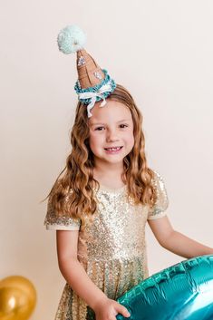 Indulge in a luxurious and unique birthday party experience with our Mermaid inspired Party Hats. Handcrafted with fine wool felt, blended with elegant sequins, silk ribbon, and intricate beadwork, these statement pieces will elevate your celebration and leave you with precious memories. Whimsical Adjustable Costume Hats And Headpieces For Party, Whimsical Tall Crown Costume Hat For Party, Whimsical Tall Crown Headpiece For Party, Whimsical Costume Hats For Carnival Party, Whimsical Costume Hats And Headpieces For Carnival Party, Gold Costume Hat With Round Crown For Party, Gold Round Crown Costume Hat For Party, Adjustable Crown Costume Hat For Party, Whimsical Structured Crown Headpiece For Party